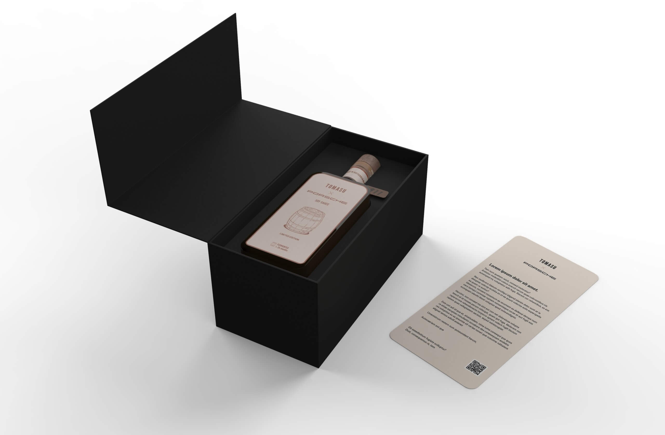 Geopende Porsche × Tomasu-geschenkverpakking met fles en kaart